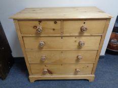 A Victorian pine two-over-three five drawer chest.