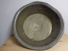 A 19th century brass dish.