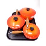 Three graduated Le Creuset cast iron sauce pans with lids (as new)
