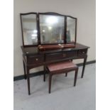 A Stag Minstrel three drawer dressing table with triple mirror and stool.
