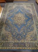 A machined Wilton carpet of Persian design on blue ground,