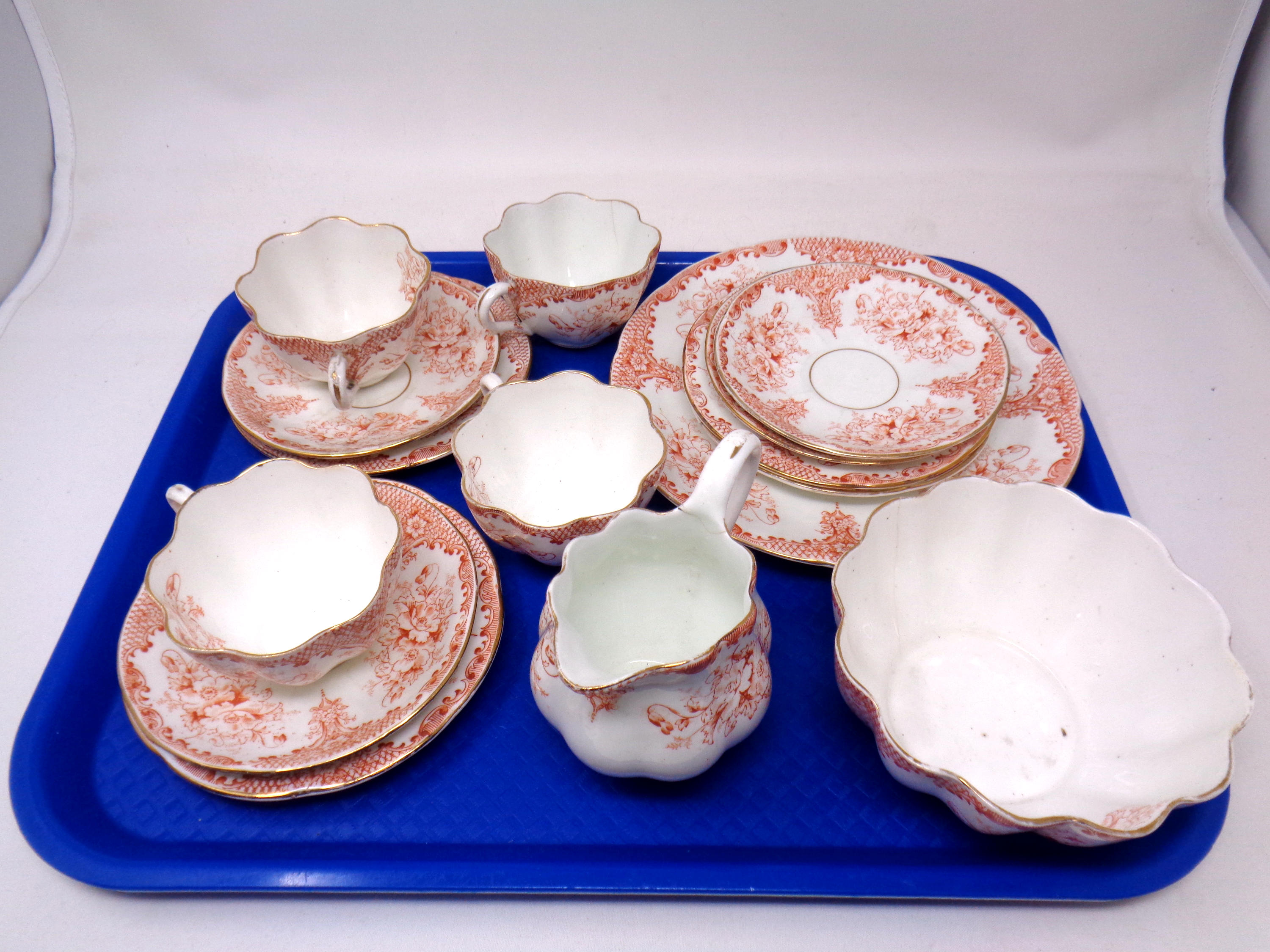 A tray containing a 15 piece antique bone china tea service.