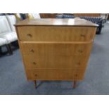 A mid-20th century four drawer chest.