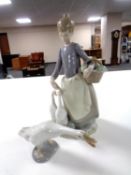 A Lladro figure - Lady with ducks, together with a further Lladro figure of a duck.