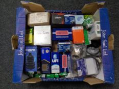 A box containing car parts by Bosch, Lucas including bulbs, fuses, relays, oil filters etc.