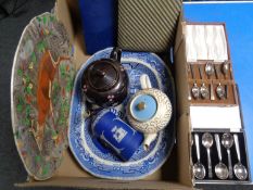 A box containing antique willow pattern meat plates, cased cutlery, teapots,