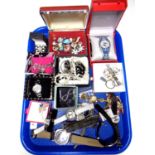 A tray containing a quantity of assorted costume jewellery and wristwatches.