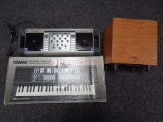 A Yamaha Portasound PSS-570 keyboard (boxed), a home mixing desk and a Wharfedale speaker.