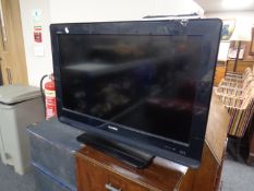 A Sony Bravia 32" LCD TV with remote.