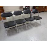 A set of four tubular metal folding kitchen chairs together with a disability walking aid