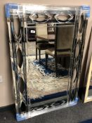 A contemporary all glass mirror, 80 x 120 cm.