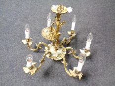An ornate Continental brass six branch chandelier.