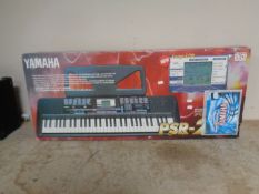 A Yamaha PSR-220 electric keyboard, boxed.