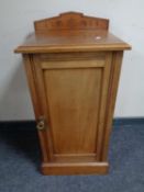 A 19th century satinwood pot cupboard.