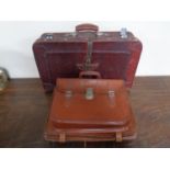Four vintage leather briefcases/satchels together with a vintage luggage case.