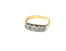 An 18ct gold and platinum five-stone diamond ring, size K CONDITION REPORT: 2.