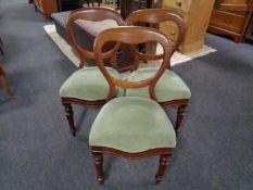 A set of three Victorian mahogany dining chairs.