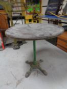 A circular bar table on a cast iron base together with further bar table (pedestal damaged).