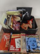 A box containing books and magazines relating to Marilyn Monroe.