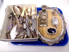 A box containing a quantity of stainless steel and silver plated cutlery, serving spoons, ladles,