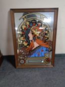 A pine framed picture mirror depicting a fortune teller.