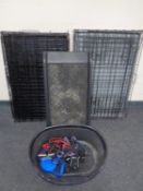 Two folding dog cages together with a car pet ramp, a cat basket and assorted pet leads.