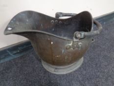 A Victorian copper coal bucket.