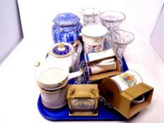 A tray containing lead crystal vases, a carriage clock, commemorative ware,
