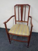 A Regency style inlaid beech armchair.