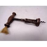 A vintage wooden-handled corkscrew.