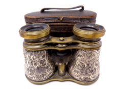 A pair of antique silver and brass-cased opera glasses in a leather case, Birmingham hallmarks.