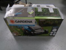 A Gardena Powermax electric lawnmower (boxed).