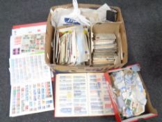 A box containing a quantity of loose worlds stamps, stamp albums, postcards etc.