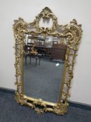 A decorative bevel edged hall mirror with metal frame.