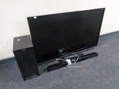 A Panasonic Viera 42" LCD TV with remote together with a Panasonic subwoofer with sound bar and