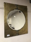 A brass framed Arts & Crafts bevel edged mirror.