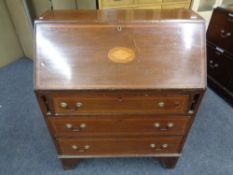 A 19th century inlaid mahogany writing bureau fitted three drawers
