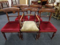 A set of four Victorian mahogany dining chairs together with a similar armchair.
