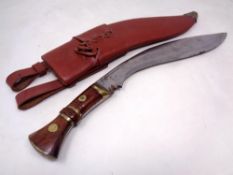 A modern Kukri knife in leather sheath.