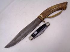 A large brass and horn handled bowie knife together with a pocket knife stamped 'Premium Stock'
