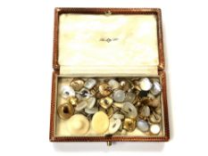 A box of vintage Gentleman's studs including examples in 9ct yellow and white gold with mother of