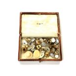 A box of vintage Gentleman's studs including examples in 9ct yellow and white gold with mother of