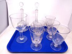 A tray containing antique and later glassware including a pair of liqueur decanters,