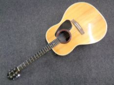 An Applause electro-acoustic guitar.