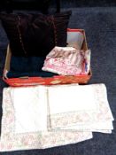 A box containing wool blanket cushion, hand stitched cushion covers, quilt etc.