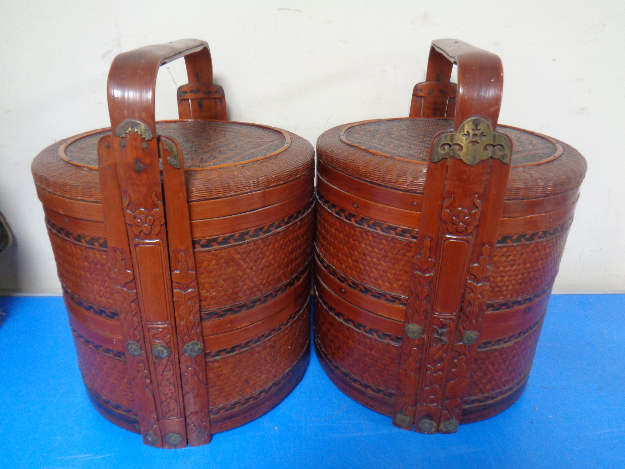 A pair of Chinese cylindrical wicker rice baskets.