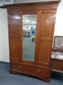 An Edwardian mahogany mirror door wardrobe together with a marble topped dressing table