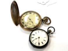 A gold plated full hunter pocket watch together with a silver fob watch.