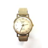 A Gentleman's 9ct yellow gold Longines 'Flagship Automatic' wristwatch, on expansion strap,
