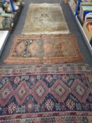 Two antique Caucasian Afshar rugs together with a Hamadan rug.